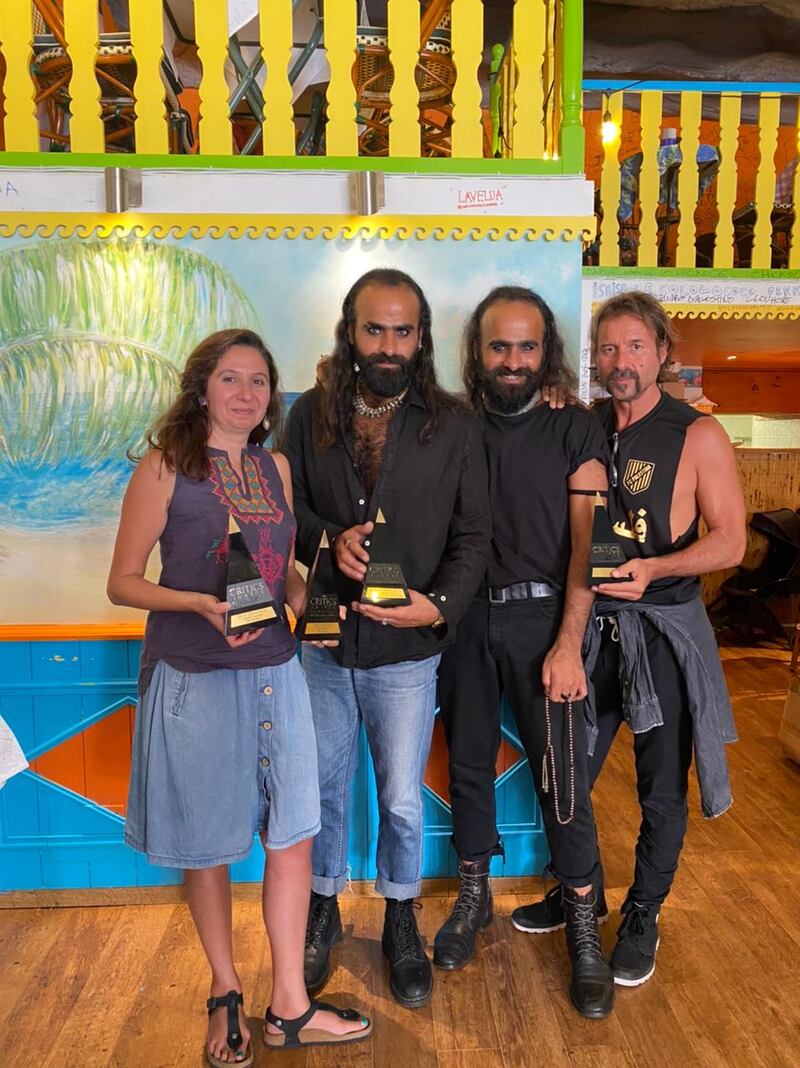 '200 Metres' by May Odeh, twin brothers Arab and Tarzan Nasser and Rani Massalha pose with their accolades at the Arab Critics Awards. Arab Cinema Centre