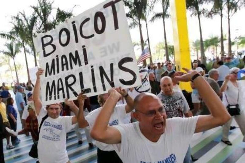 People demonstrate outside Marlins Park in Miami on April 10, 2012, Miami Marlins manager Ozzie Guillen said that he was a fan of Fidel Castro. Guillen was suspended by the team for his comments but that did not stop the public uproar.