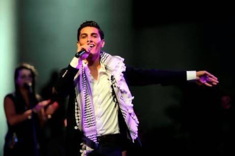 Mohammed Assaf performs in the West Bank city of Ramallah last month. Abbas Momani / AFP