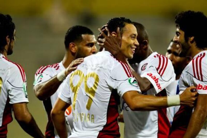Al Jazira's Ricardo De Oliveira is congratulated by teammates after scoring against Ajman during the first half of their quarterfinal UAE Presidents Cup match at Al Wasl Stadium in Dubai on January 9, 2012. Christopher Pike / The National

For story by: 44927
Job ID: Ahmed Rizvi