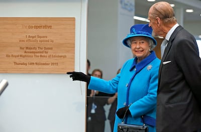 Queen Elizabeth, above with Prince Philip, opened the Co-op's headquarters a decade ago. Getty