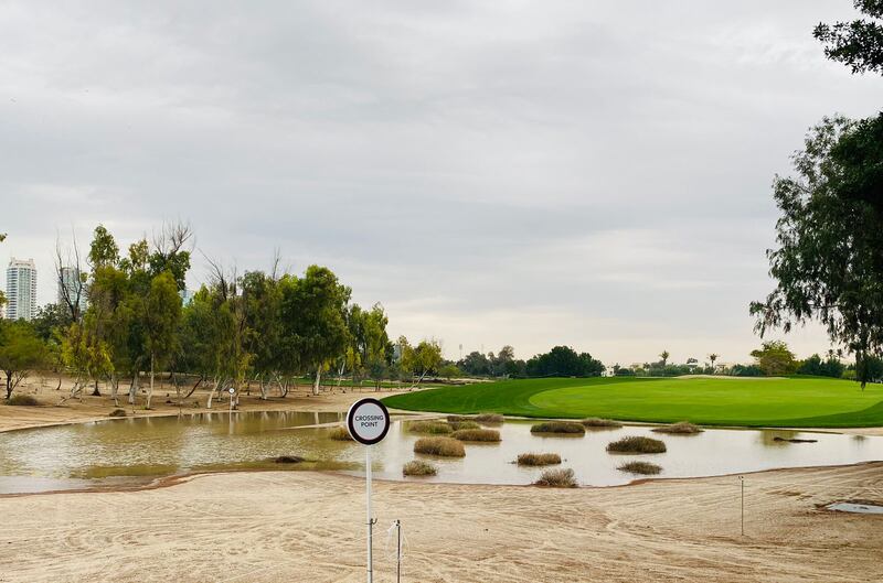 A pond emerged between the 17th tee box and the start of the fairway on Tuesday morning, after heavy overnight rain. Paul Radley / The National