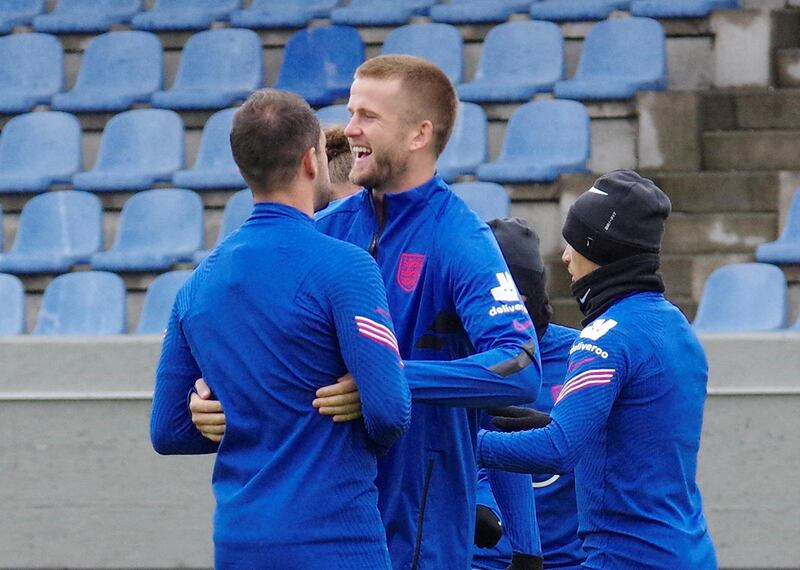 England's Eric Dier, centre, with teammates. Reuters