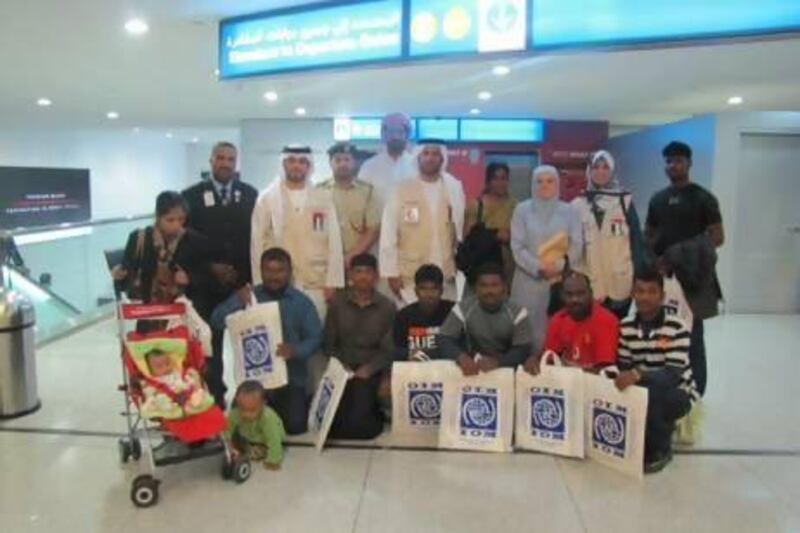 Eleven of the Sri Lankan refugees at Dubai airport before flying out to their new homes in the US last month. Photo courtesy Red Crescent Authority