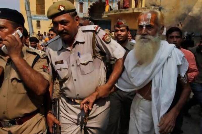 Police detain an elderly Hindu holy man in Ayodhya for allegedly defying a ban on pilgrimages to a disputed holy site that has been the cause of deadly clashes between Hindus and Muslims.