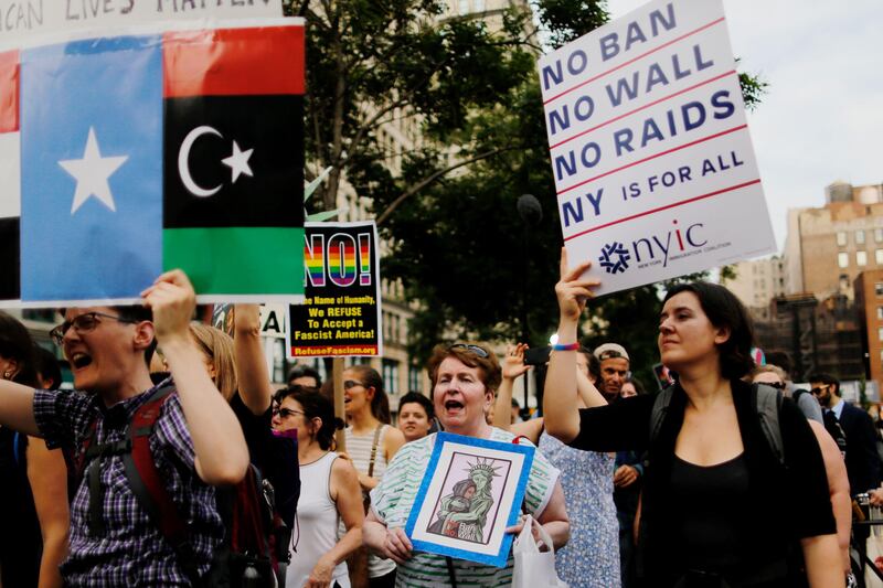 (FILES) This file photo taken on March 08, 2017 shows people taking part in a rally to protest the restrictive guidelines issued by the US on who qualifies as a close familial relationship under the Supreme Court order on the Muslim and refugee ban at Union Square  in New York.
The Supreme Court dealt President Donald Trump's government a fresh setback on July 19, 2017, saying its controversial travel ban cannot be applied to grandparents and other close relatives of people living in the US -- for now. The court accepted a Hawaii district judge's ruling last week that the Trump administration had too narrowly defined what constitutes "close family relationships" to determine exceptions to the ban on travelers from six mainly Muslim countries -- Iran, Libya, Somalia, Sudan, Syria and Yemen.
 / AFP PHOTO / EDUARDO MUNOZ ALVAREZ