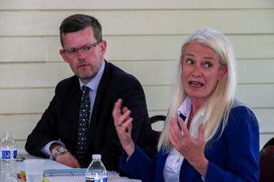 Ben Ladd, former deputy director of overseas territories, and Amanda Milling, UK Minister for Overseas Territories, meet community leaders in the British Virgin Islands. Reuters