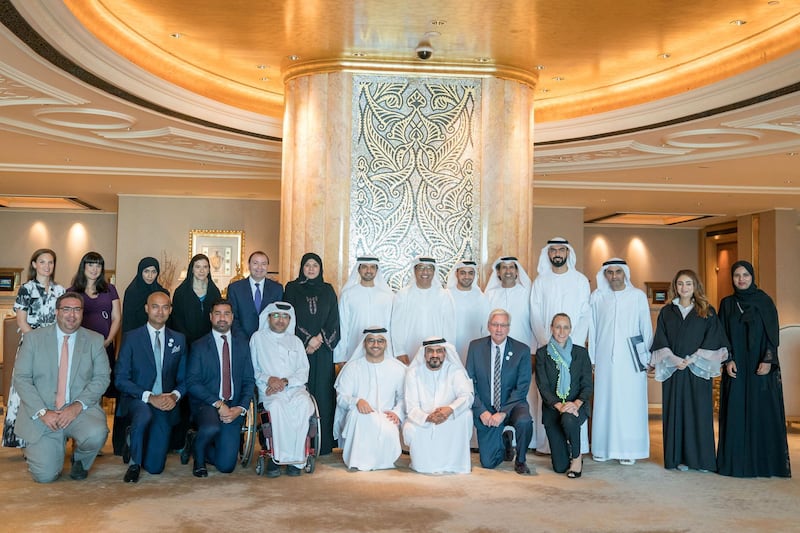 ABU DHABI, UNITED ARAB EMIRATES - June 24, 2019: HE Mohamed Al Junaibi, Director of the President's Protocol Office at the UAE Ministry of Presidential Affairs and Chairman of the Special Olympics Higher Committee (back row, 7th R), stands for a group photo with members of the Higher Committee and Local Organizing Committee of the Special Olympics World Games Abu Dhabi 2019, at Emirates Palace. Seen with: Tala Al Ramahi, Chief Strategy Officer of the Special Olympics World Games Abu Dhabi 2019 (2nd R), HE Dr. Ali Bin Tamim Director General, Abu Dhabi Media (3rd R), HE Saif Ghobash Director General, Department of Tourism and Culture Abu Dhabi (4th R), HE Mohamed Fadel Al Hameli Chairman, UAE Disabled Sports Federation (5th R), Khalfan Al Mazroui, Managing Director of the Special Olympics World Games Abu Dhabi 2019 (6th R), HE Dr. Fahad Matar Al Neyadi
Director General, General Secretariat of Executive Council (7th R), HE Sana Suhail Secretary General, Ministry of Community Development (8th R) and other dignitaries. 

( Mohamed Al Hammadi / Crown Prince Court - Abu Dhabi )
---