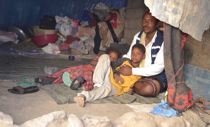 Abdulwasse Hassan and his family inside a tent in Al Maafer district on 16 February after they fled another camp. Mohammed Al Qalisi for the National