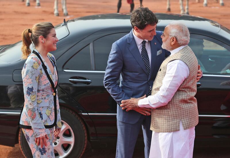 Mr Modi welcomes Mr Trudeau as the Canadian prime minister's wife, Sophie Gregoire Trudeau, looks on. Manish Swarup / AP