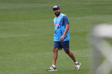 India's captain Rohit Sharma walk in the field before the start of a practice session ahead of their ICC men’s Twenty20 World Cup 2022 cricket match against Pakistan, at the Melbourne Cricket Ground in Melbourne on October 22, 2022.  (Photo by Surjeet YADAV  /  AFP)  /  -- IMAGE RESTRICTED TO EDITORIAL USE - STRICTLY NO COMMERCIAL USE --