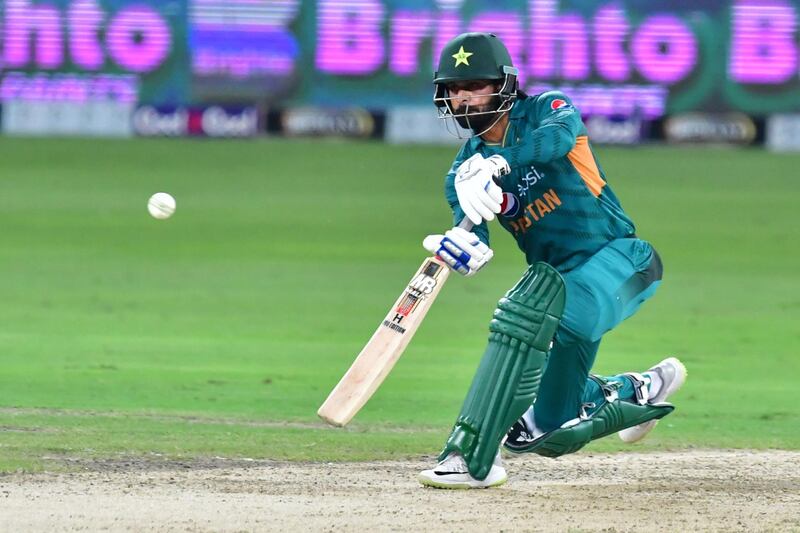 Pakistan batsman Mohammad Hafeez plays a shoot during the third T20 cricket match between Pakistan and Australia at The International Cricket Stadium in Dubai on October 28, 2018. / AFP / GIUSEPPE CACACE
