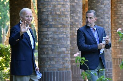 US President Joe Biden walks alongside his son Hunter after attending Mass at Holy Spirit Catholic Church in Johns Island, South Carolina. AFP