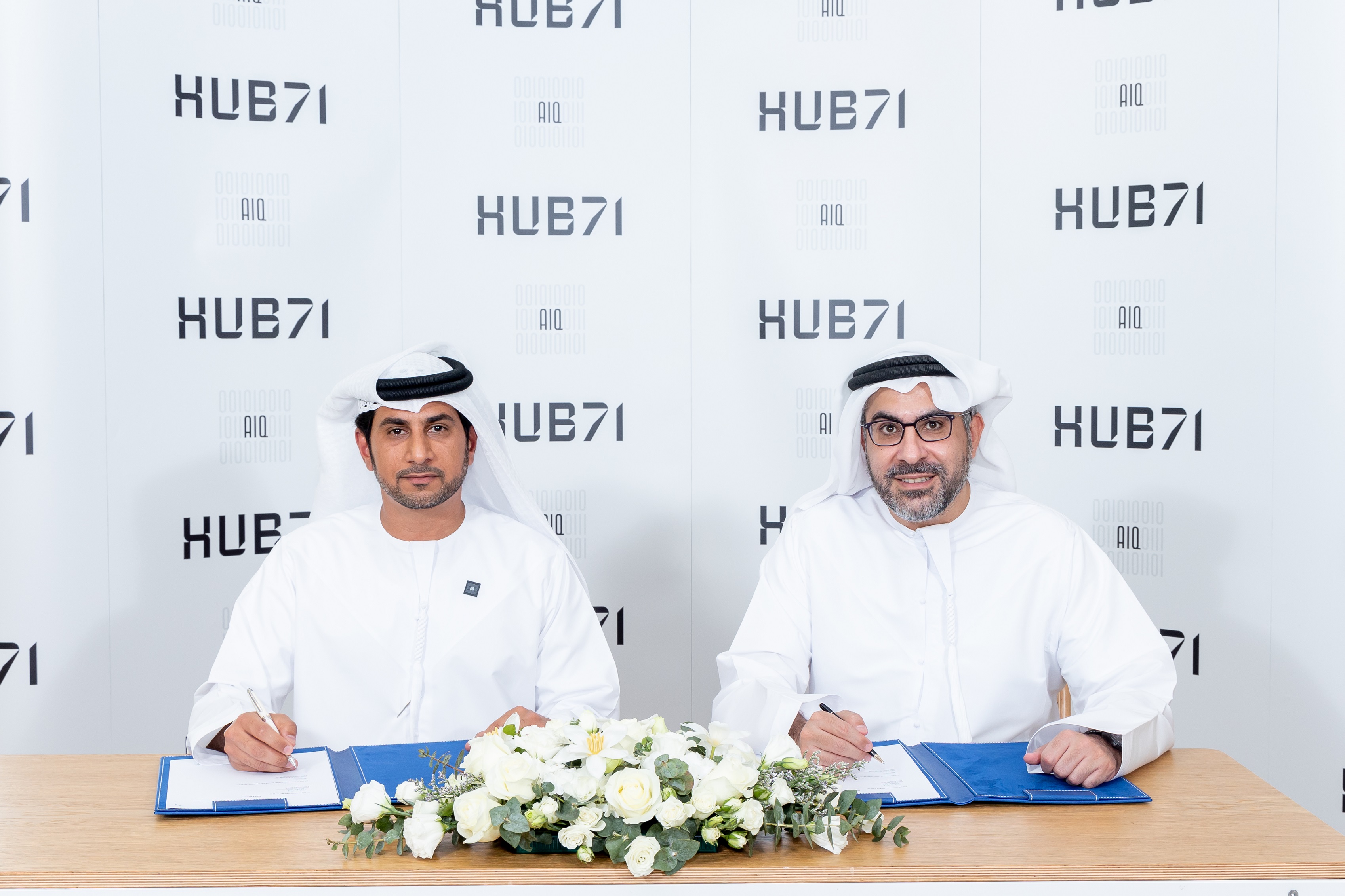 Omar Al Marzooqi, chief executive of AIQ, and Badr Al-Olama, acting chief executive of Hub71, signed the agreement. Photo: Hub71