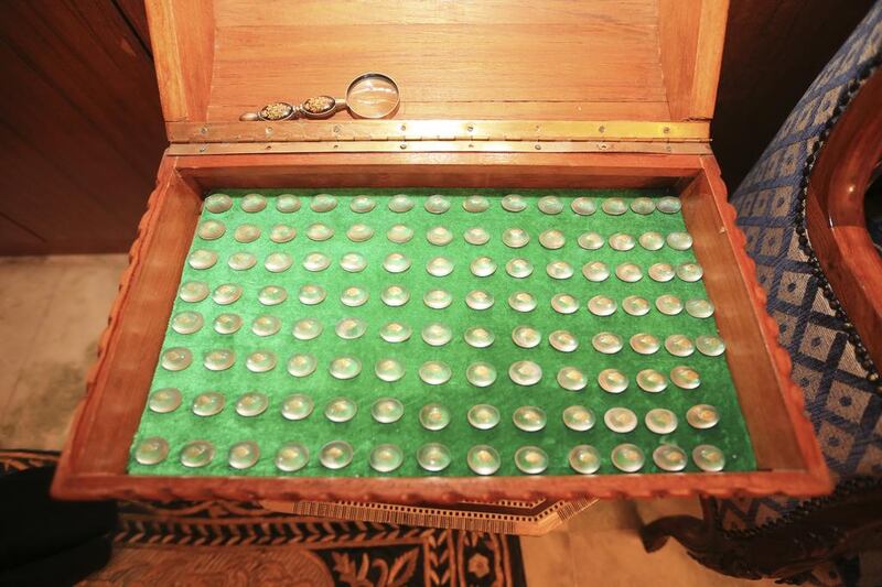 Inside this book-shaped box are 144 small precious stones - each with a chapter of the Quran engraved on it, says Mr Al Junaibi. It is a unique item from the early 20th century and sold at auction for US$20,000 (Dh73,000). Sarah Dea/The National