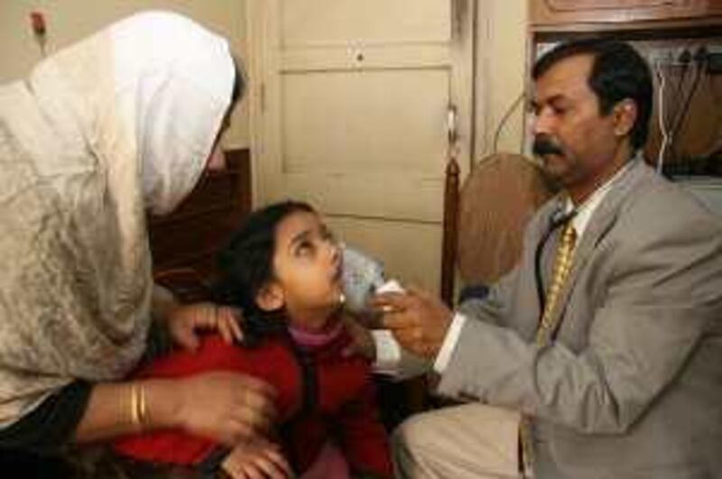 Six-year-old Sarah Akhtar has been suffering from respiratory crisis for almost 2 years, since she began taking a busy Kolkata road to commute to her school. Dr Timir Garai, the child's physician is explaining Sarah's mother how to use a nebuliser for better efficacy of her medicine, to help the child breathe comfortably. Dr Garai says, excessive air pollution is the root cause why the child has been suffering from respiratory problems throughout the year.   
 
All pics by: Shaikh Azizur Rahman  *** Local Caption ***  Auto Pollution 2.jpg