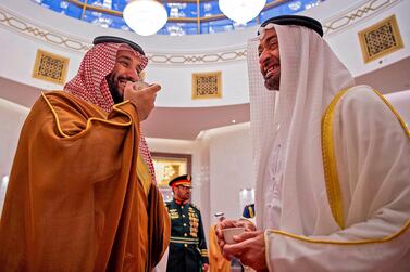 Mohamed bin Zayed, Crown Prince of Abu Dhabi and Deputy Supreme Commander of the UAE Armed Forces, and Saudi Crown Prince Mohammed bin Salman drink coffee in Abu Dhabi. AFP / Saudi Royal Palace 