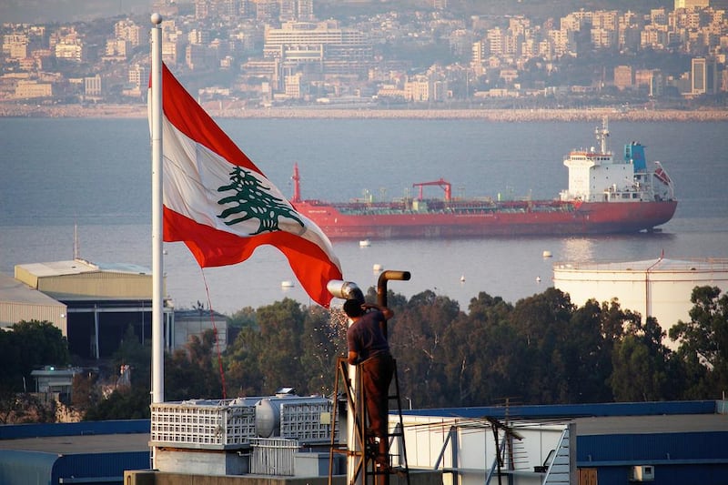 A ship sits at anchor off Beirut's port. After the Syrian civil war cut off Lebanon's overland trade route to Jordan, Iraq and the Gulf, Beirut's port has seen a marked uptick in activity. Josh Wood/The National