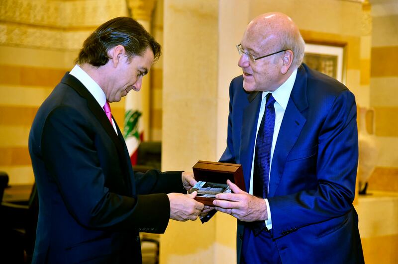 Lebanese Prime Minister Najib Mikati, right, presents a gift to US Envoy for Energy Affairs Amos Hochstein in Beirut. AP