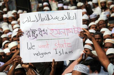 DHAKA, BANGLADESH - MARCH 25: Hard-line Islamist groups in Bangladesh stage a rally threatening large-scale protests if the decision to scrap Islam as the official state religion of the Muslim-majority nation is seen through, on March 25, 2016 in Dhaka, Bangladesh.

Thousands activist of hard-line groups with Hefazat-e-Islam to to the streets after the Friday prayer sneering the government for not taking "sufficient actions" to stop "mockery" against Islam where 90 percent of the population is Muslim.

PHOTOGRAPH BY Zakir Hossain Chowdhury / Barcroft Media

UK Office, London.
T +44 845 370 2233
W www.barcroftmedia.com

USA Office, New York City.
T +1 212 796 2458
W www.barcroftusa.com

Indian Office, Delhi.
T +91 11 4053 2429
W www.barcroftindia.com (Photo credit should read Zakir Hossain Chowdhury / Barcro / Barcroft Media via Getty Images)