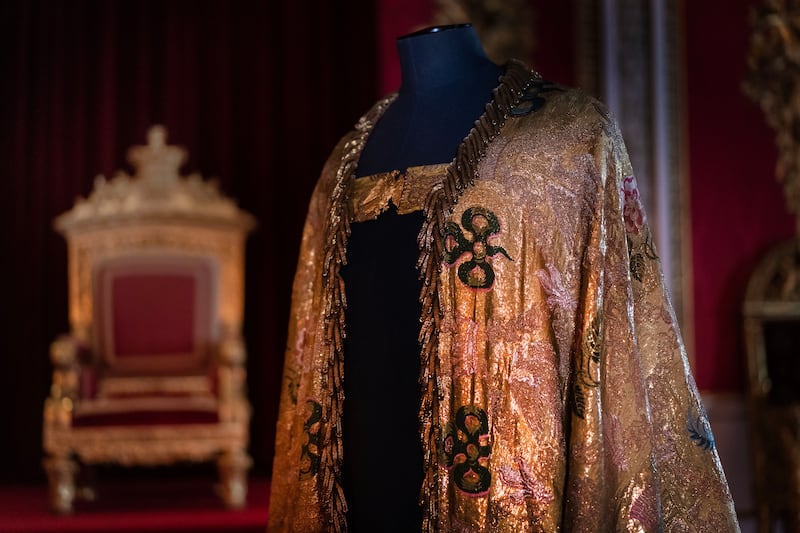 Detail of the Imperial Mantle which forms part of the Coronation Vestments, displayed in the Throne Room at Buckingham Palace. PA