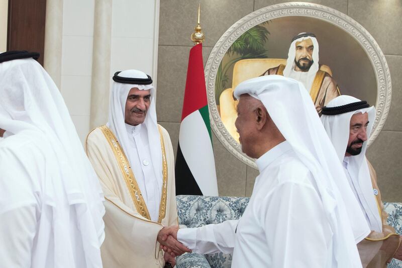 ABU DHABI, UNITED ARAB EMIRATES - June 15, 2018: HH Sheikh Humaid bin Rashid Al Nuaimi, UAE Supreme Council Member and Ruler of Ajman (L), greets a guest during an Eid Al Fitr reception at Mushrif Palace. Seen with HH Dr Sheikh Sultan bin Mohamed Al Qasimi, UAE Supreme Council Member and Ruler of Sharjah (R).

( Saeed Al Neyadi / Crown Prince Court - Abu Dhabi )
---