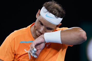 Rafael Nadal of Spain wipes the sweat from his face during his second round match against Mackenzie McDonald of the U. S. , at the Australian Open tennis championship in Melbourne, Australia, Wednesday, Jan.  18, 2023.  (AP Photo / Asanka Brendon Ratnayake)