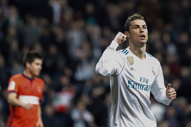 epa06517007 A picture made available on 11 February 2018 shows Real Madrid's Cristiano Ronaldo (R) celebrates the team's win on the Spanish Primera Division soccer match between Real Madrid and Real Sociedad at the Santiago Bernabeu stadium, Madrid, Spain, 10 February 2018.  EPA/Emilio Naranjo