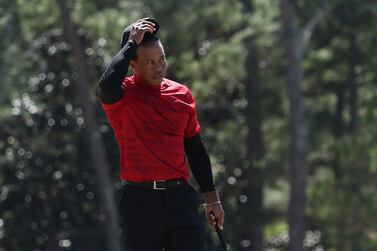 AUGUSTA, GEORGIA - APRIL 10: Tiger Woods tips his hat to the crowd on the 18th green after finishing his round during the final round of the Masters at Augusta National Golf Club on April 10, 2022 in Augusta, Georgia.    Gregory Shamus / Getty Images / AFP
