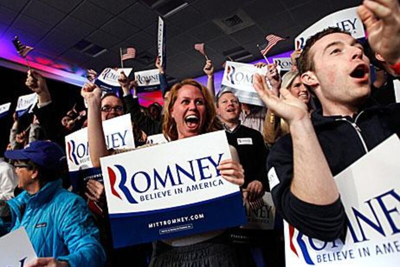 Supporters of Mitt Romney, the Republican presidential election candidate, celebrate after he wins the New Hampshire primary yesterday.