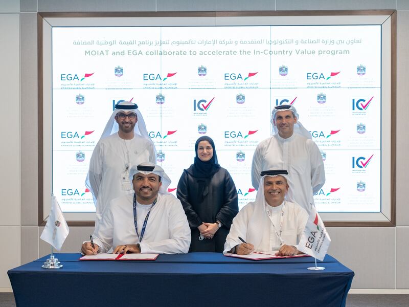 Dr Sultan Al Jaber and Khaldoon Al Mubarak at the signing ceremony between Omar Suwaina Al Suwaidi and Abdulnasser bin Kalban. Photo: MoIAT