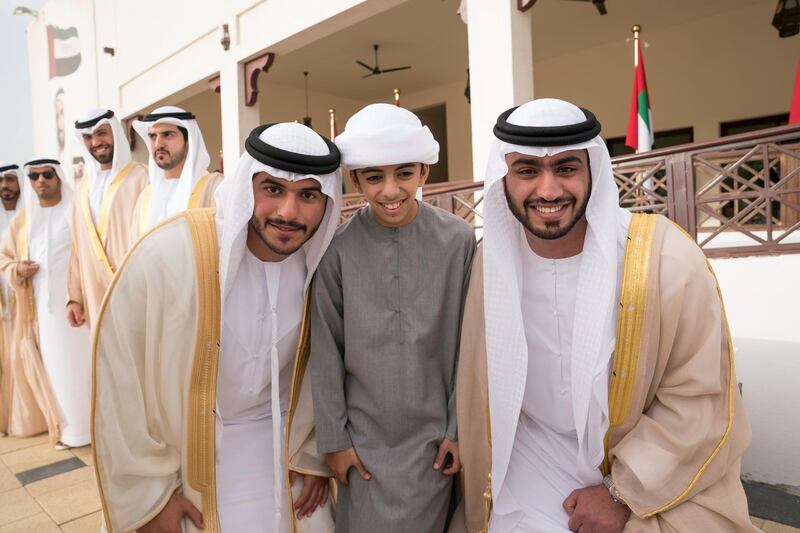 ABU DHABI, UNITED ARAB EMIRATES - January 21, 2018: HH Sheikh Rashid bin Hamdan bin Zayed Al Nahyan (C) stands for a photograph during a mass wedding reception for HH Sheikh Mubarak bin Hamdan bin Mubarak Al Nahyan (R), HH Sheikh Mohamed bin Ahmed bin Hamdan Al Nahyan (L) and other grooms, at Majlis Al Bateen.

( Mohamed Al Hammadi / Crown Prince Court - Abu Dhabi )
---