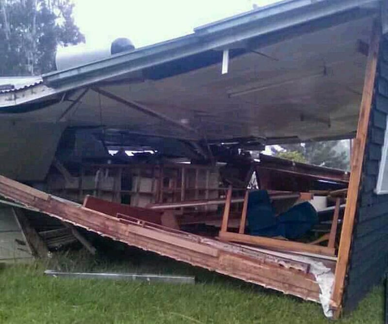 A house sits collapsed following a strong earthquake, Tuesday, Feb. 27, 2018, in Halagoli, Hela Province, Papua New Guinea. Severe damage after Monday's powerful 7.5 magnitude earthquake in Papua New Guinea is hindering efforts to assess the destruction, although officials fear dozens of people may have been injured or killed. (Jerol Wepii via AP)