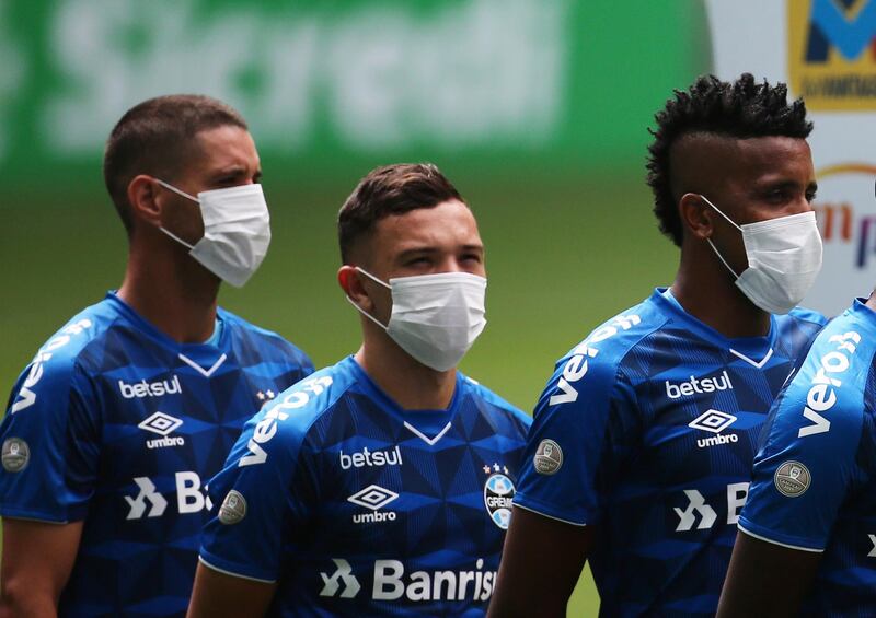 Gremio players wearing masks before the match. Reuters