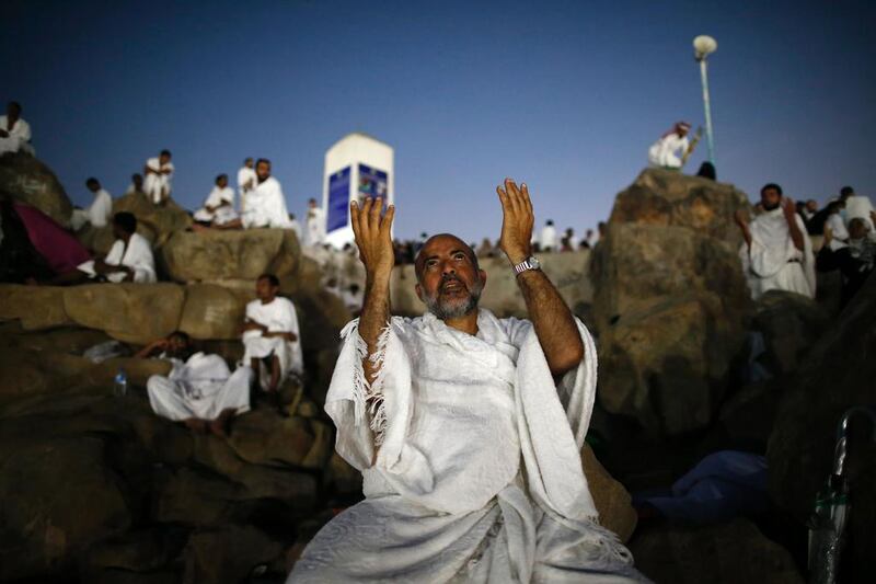 Haj pilgrims on Mount Arafat, near Mecca, early on Sunday before day-long prayers and Quran recitals. Ahmad Gharabli / AFP