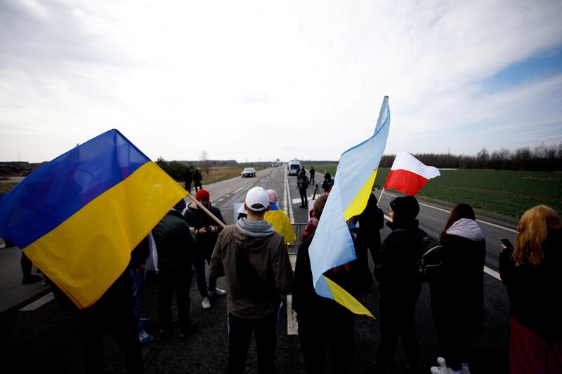 People take part in a protest against the transport of cargo to Russia and Belarus near the Polish-Belarusian border crossing in Koroszczyn, eastern Poland. EPA