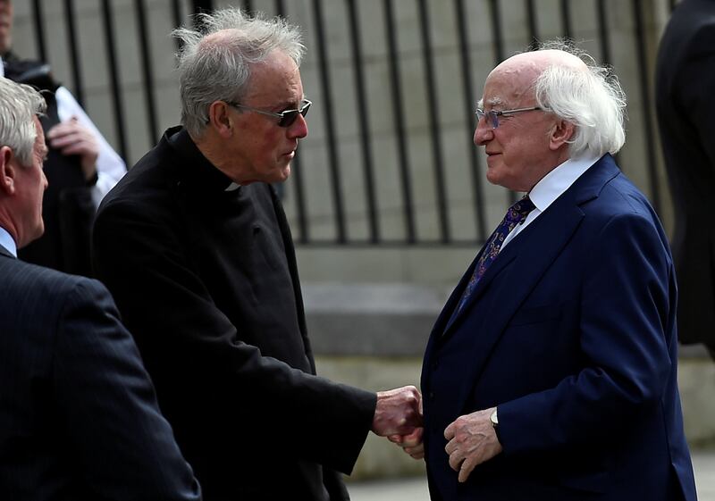 Ireland's President Michael D. Higgins arrives at the funeral. Reuters