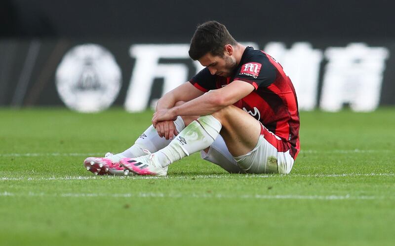 Soccer Football - Premier League - Wolverhampton Wanderers v AFC Bournemouth - Molineux Stadium, Wolverhampton, Britain - June 24, 2020 Bournemouth's Lewis Cook looks dejected after the match, as play resumes behind closed doors following the outbreak of the coronavirus disease (COVID-19) Catherine Ivill/Pool via REUTERS  EDITORIAL USE ONLY. No use with unauthorized audio, video, data, fixture lists, club/league logos or "live" services. Online in-match use limited to 75 images, no video emulation. No use in betting, games or single club/league/player publications.  Please contact your account representative for further details.