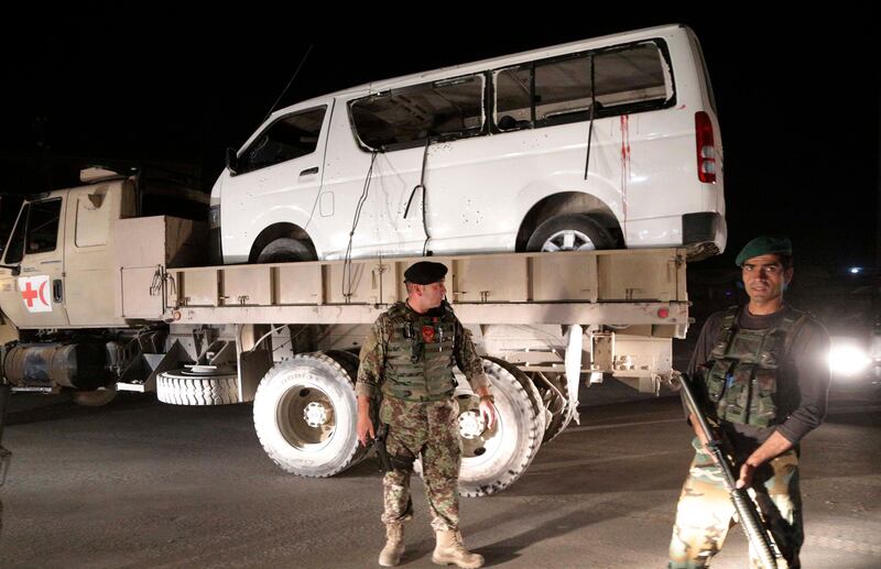 epa06280656 Afghan security officials remove a damaged vehicle after a suicide bomb attack that targeted Marshal Fahim military academy in Kabul, Afghanistan, 21 October 2017. At least 15 Afghan military cadets were killed and four were injured in the attack claimed by Taliban militants. The bombing came a day after two suicide attacks at Afghan mosques left at least 80 people dead.  EPA/HEDAYATULLAH AMID