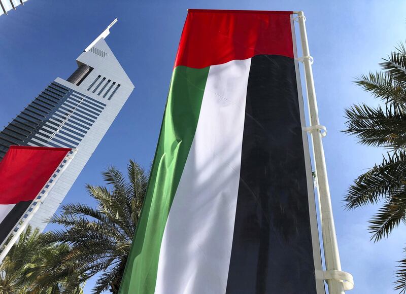 Dubai, United Arab Emirates - November 30, 2020: National Day. UAE flags outside Emirates towers. Monday, November 30th, 2020 in Dubai. Chris Whiteoak / The National