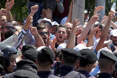 Jordanian teachers chant slogans during a protest to demand pay rises in Amman on September 5, 2019. AFP