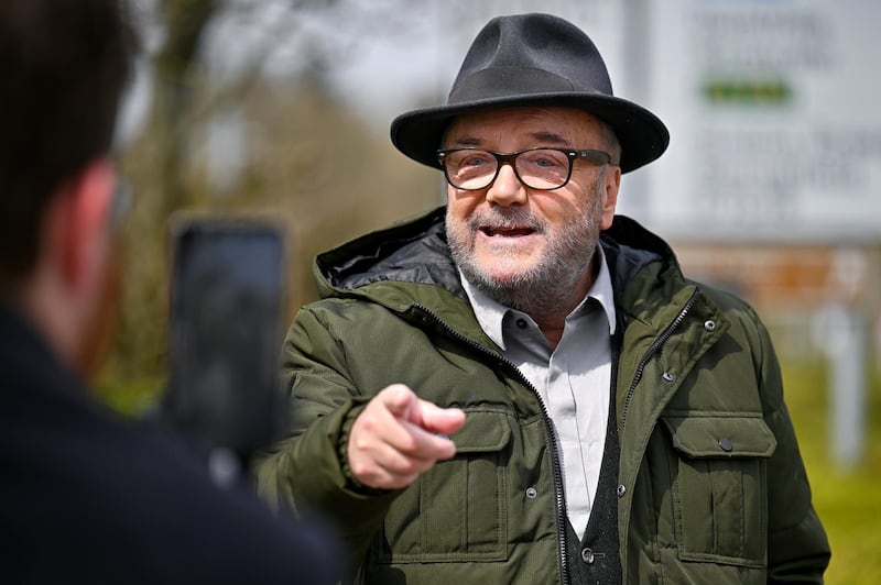 GRETNA GREEN, SCOTLAND - APRIL 20: George Galloway leader of the All For Unity Party campaigns during the Scottish Parliament election with a speech at the Gretna Gateway Outlet on April 20, 2021 in Gretna, Scotland. Mr Galloway visited Gretna with his wife Gayatri, where he gave a speech slamming First Minister Nicola Sturgeon's handling of the Coronavirus pandemic. (Photo by Jeff J Mitchell/Getty Images)