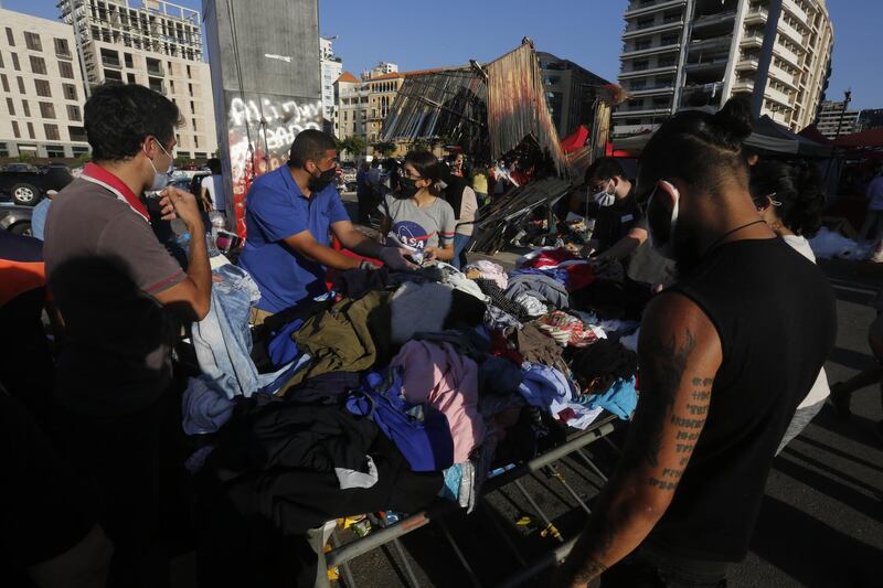 People collect donated items in Martyrs Square to help those affected by the devastating explosion. Getty Images