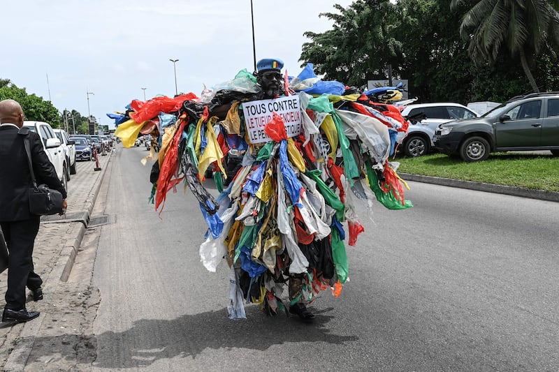 A man dressed in plastic waste marks the 50th World Environment Day celebrations in Abidjan, Ivory Coast. AFP