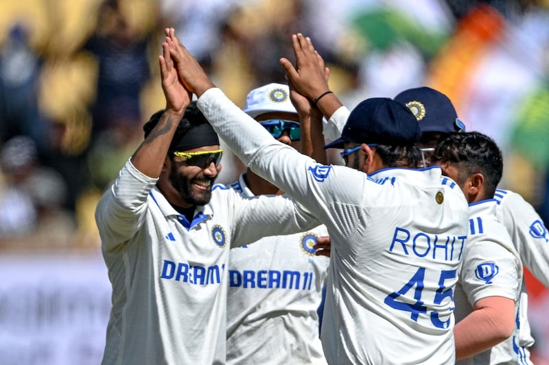 India's Ravindra Jadeja, left, picked up five wickets to dismiss England for 122 and wrap up a 434-run win in the third Test against England in Rajkot. AFP