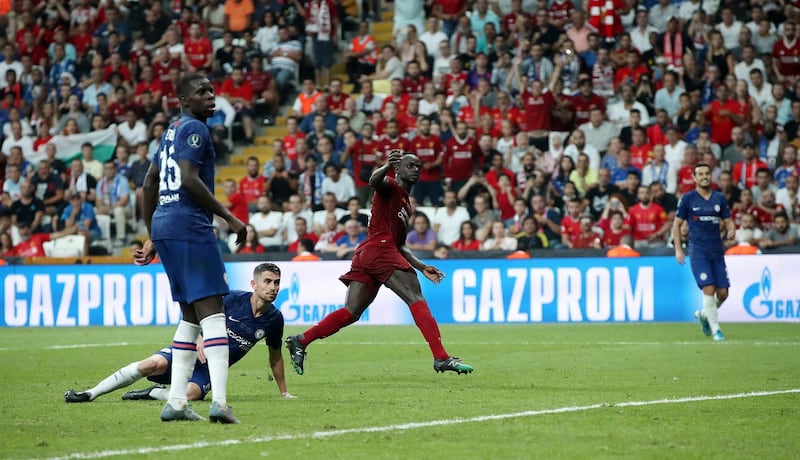 Liverpool's Sadio Mane scores his side's second goal. PA Wire