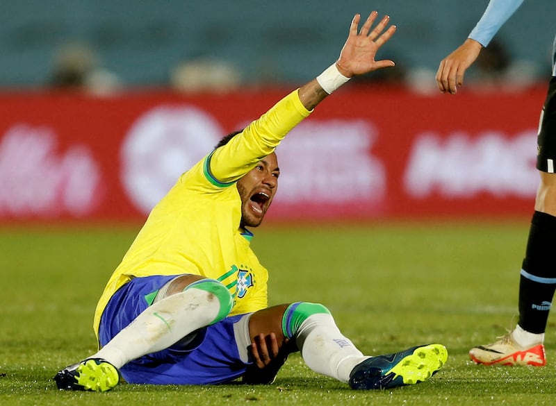 Brazil's Neymar reacts after sustaining a serious knee injury against Uruguay. Reuters
