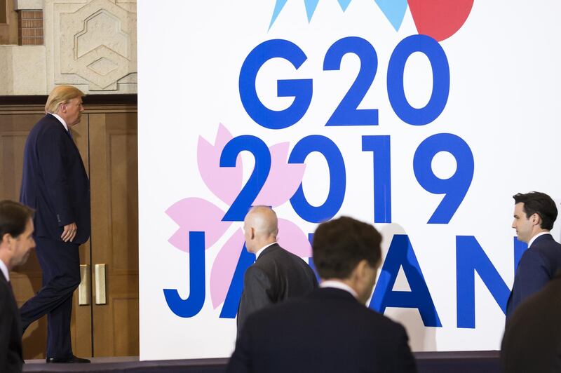 OSAKA, JAPAN - JUNE 29: U.S. President Donald Trump (2-L) leaves a press conference after the G-20 Summit on June 29, 2019 in Osaka, Japan. Trump and Chinese President Xi Jinping agreed to resume trade negotiations on Saturday during their meeting in Osaka at the annual Group of 20 summit, in an attempt to resolve a trade deal between the world's two largest economies. According to reports, both leaders agreed that the U.S. would not impose new tariffs during their discussion as world leaders met in Osaka during the two-day G20 summit to discuss economic, environmental and geopolitical issues. (Photo by Tomohiro Ohsumi/Getty Images)