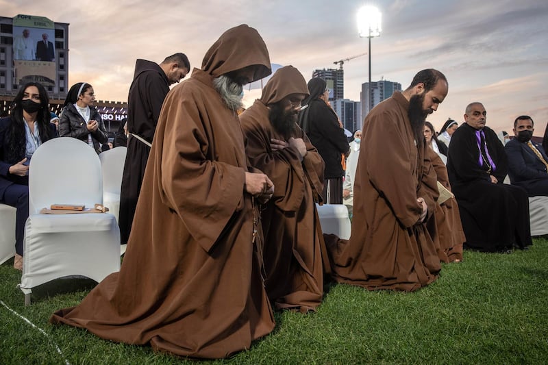 Monks pray during a mass conducted by Pope Francis at the  Franso Hariri Stadium. Getty Images