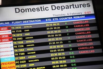 A digital display shows cancelled flights at Sabiha Gokcen International airport after a Pegasus Airlines Boeing 737 airplane skidded off the runway upon landing at Sabiha Gokcen airport in Istanbul on February 5, 2020.  One person died and 157 were injured when a plane carrying 177 people skidded off the runway at an Istanbul airport, caught fire and split into three after landing in rough weather on February 5. / AFP / Ozan KOSE
